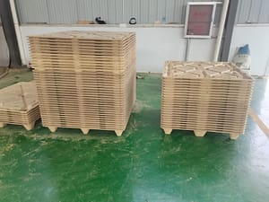 A pile of molded pallets are placed in the workshop and have just been produced.